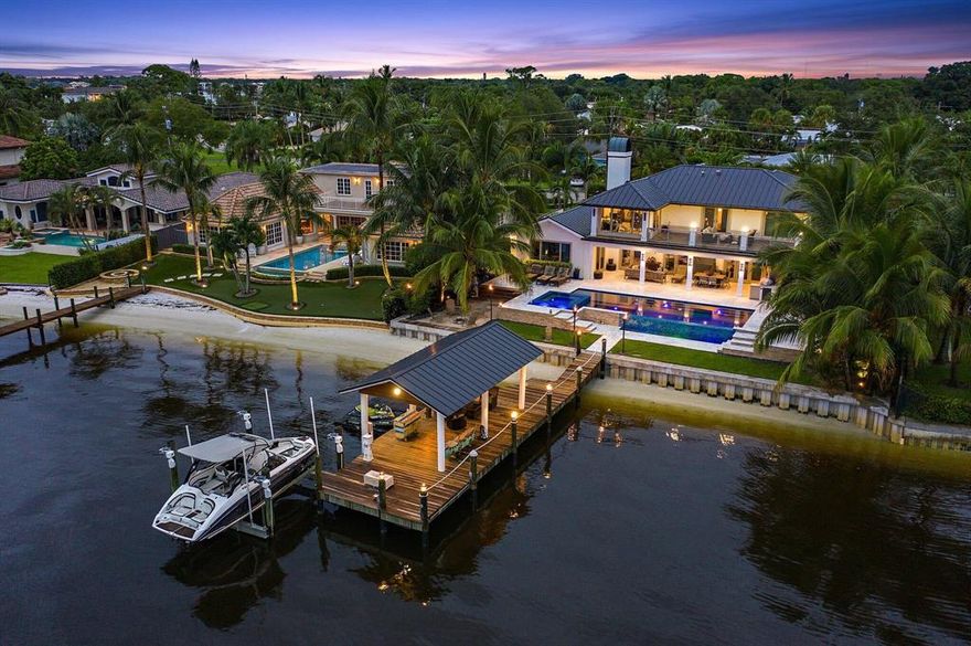 Extensive renovations in 2017 bring this stunning south facing Loxahatchee River home to like new status! The transitional styled front elevation and paver drive welcome you. Items of significance include all new wiring with new panels, Control 4 system, 3 ac units and ductwork. The 500 gallon propane tank fuels the range & Salamander broiler,  whole house insta-hot water, master bath steam shower, dryer,  pool heater, tiki torches, fire pits, summer kitchen grill, and Generac generator. The chef's kitchen is complete w double ovens and induction cooktop.  Ground floor master suite, 3 en suite guest rooms on the upper level.   Everyone will enjoy the living and a spacious outdoor terrace with sweeping river views. New sea wall and infinity edge pool with elevated spa.