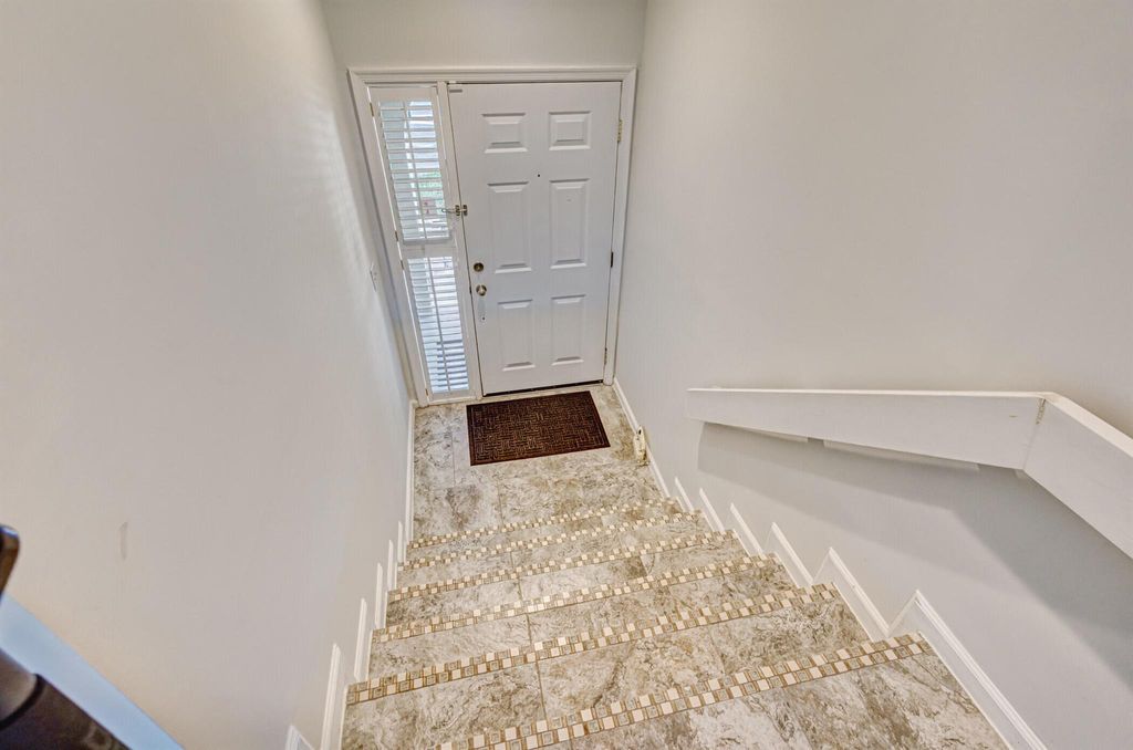 Photo of 12 Lexington Lane E #C, Palm Beach Gardens, FL 33418 (MLS # R10968807)