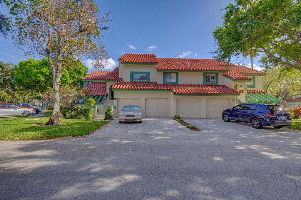 Photo of 12 Lexington Lane E #C, Palm Beach Gardens, FL 33418 (MLS # R10968807)