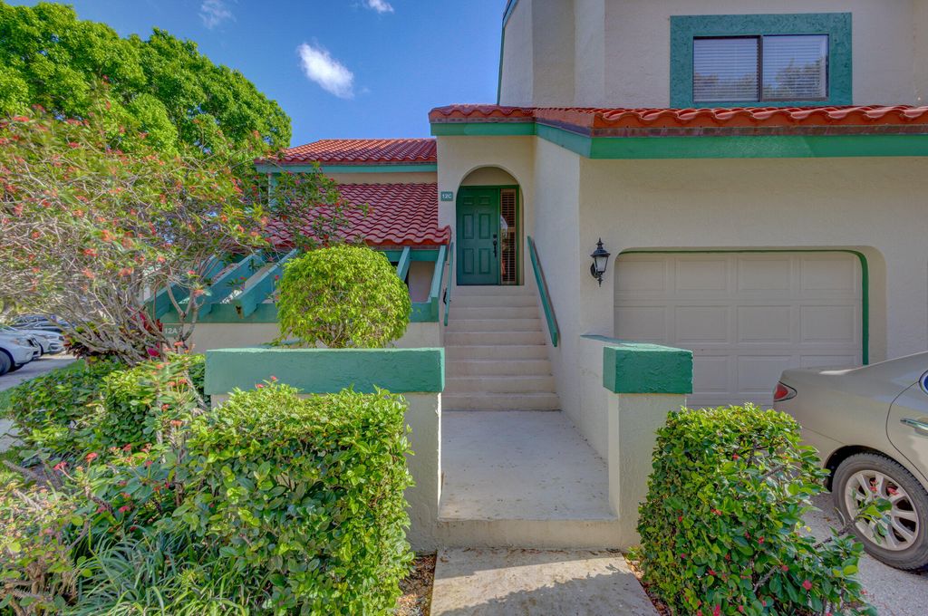 Photo of 12 Lexington Lane E #C, Palm Beach Gardens, FL 33418 (MLS # R10968807)