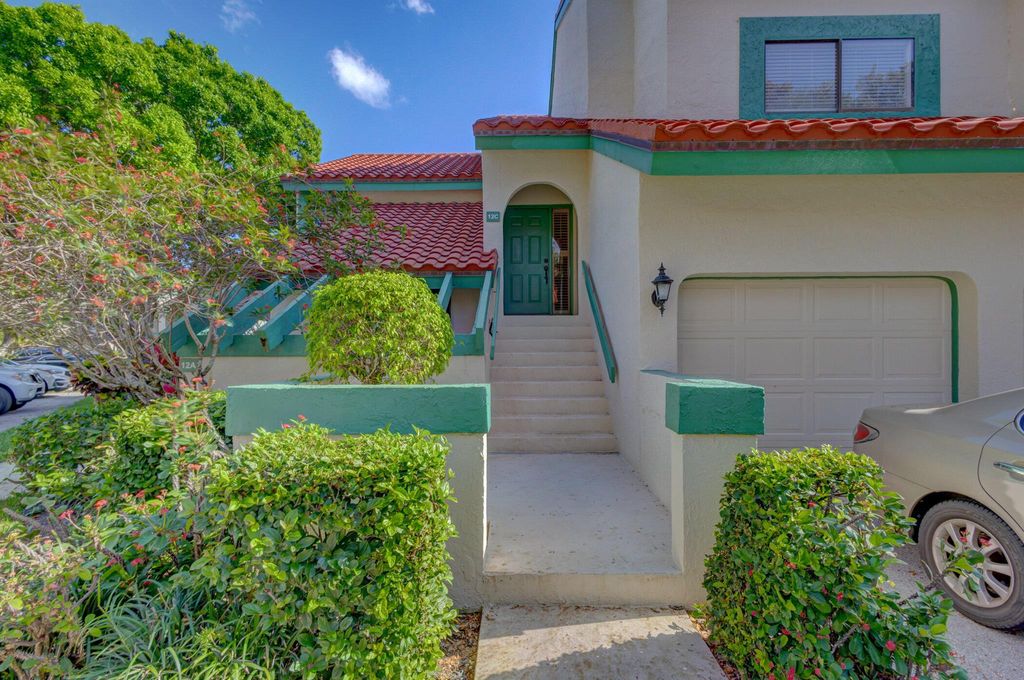 Photo of 12 Lexington Lane E #C, Palm Beach Gardens, FL 33418 (MLS # R10968807)