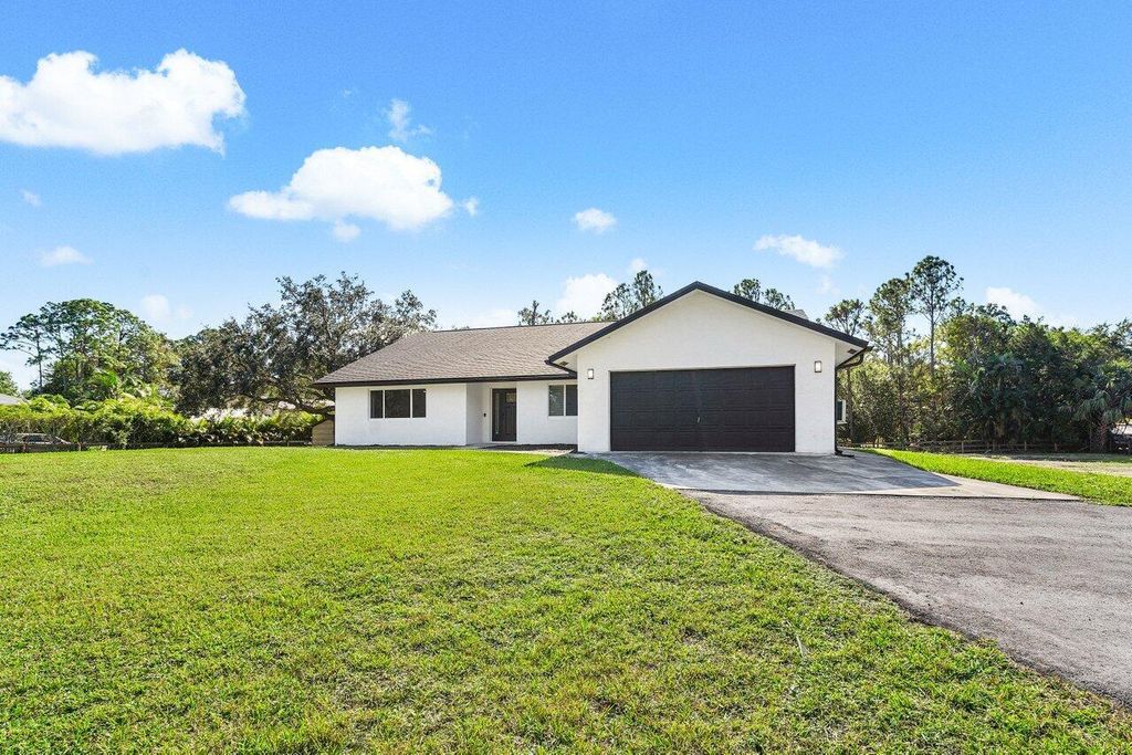 Photo of 13884 47th Court N, West Palm Beach, FL 33411 (MLS # R10944314)