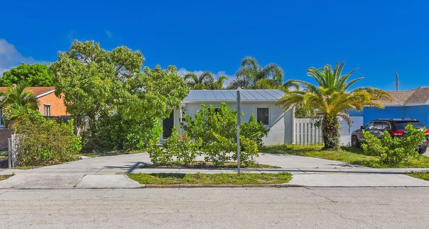 This completely renovated 3-bedroom home is available for rent in the sought-after Southerly Hills neighborhood of West Palm Beach. The property features a new metal roof (2022), a modern kitchen with 42" hardwood cabinetry and granite countertops (2021), brand new stainless steel appliances, a fully renovated bathroom, new luxury vinyl plank flooring, and a recently painted exterior. Additional highlights include a washer/dryer, attached garage, and a large fenced-in backyard. Ideally located just over 2 miles from Palm Beach Island and only 3 miles from downtown West Palm Beach. Available furnished at $3,500/month or unfurnished at $3,300/month.