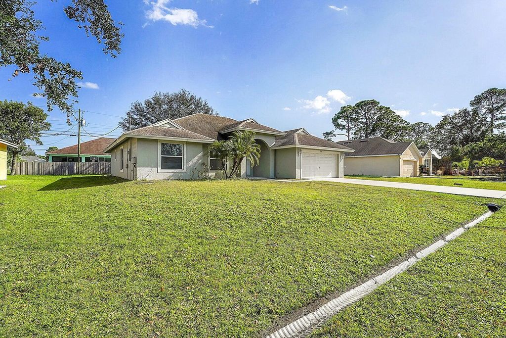 Photo of 3615 SW Foremost Drive, Port Saint Lucie, FL 34953 (MLS # R11059194)