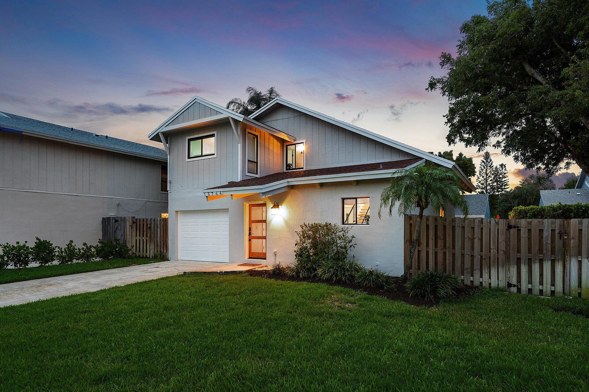 Rare opportunity to own this modern turnkey home with warm coastal vibes on a huge oversized lot near pristine Beaches of Delray Beach. Just a quick ride to downtown this exceptional home comes professionally furnished and decorated along with four beach cruisers! Reconfigured open-kitchen, high-vaulted ceilings, cedar-wood beams, stainless-steel appliances, modern vanities, quartz counters, porcelain-tile floors wall-to-wall, and hurricane garage door are just some of the features this home offers. Master bedroom downstairs with patio. Huge backyard completely fenced-in with gate! Room for pool! Elongated driveway has room for multiple cars. Completely repainted interior and exterior. This gem is perfect for a vacation home, permanent home, long or short term rental. No HOA!