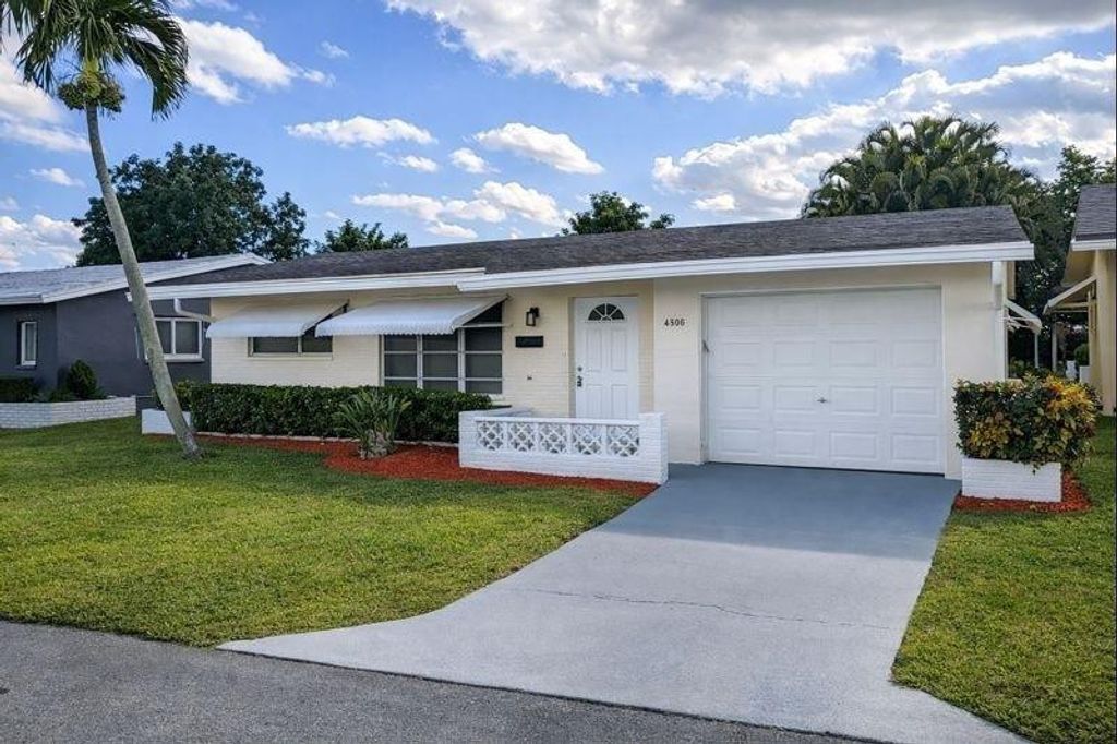 Photo of 4906 NW 53rd Court, Tamarac, FL 33319 (MLS # B26026563)