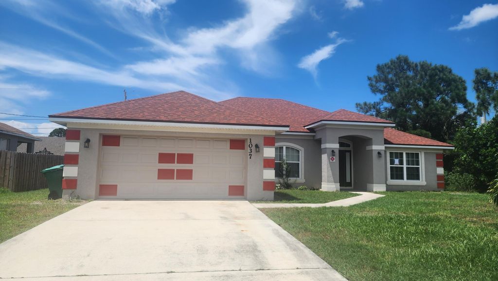 Photo of 1037 SW Hamrock Avenue, Port Saint Lucie, FL 34953 (MLS # R11048698)