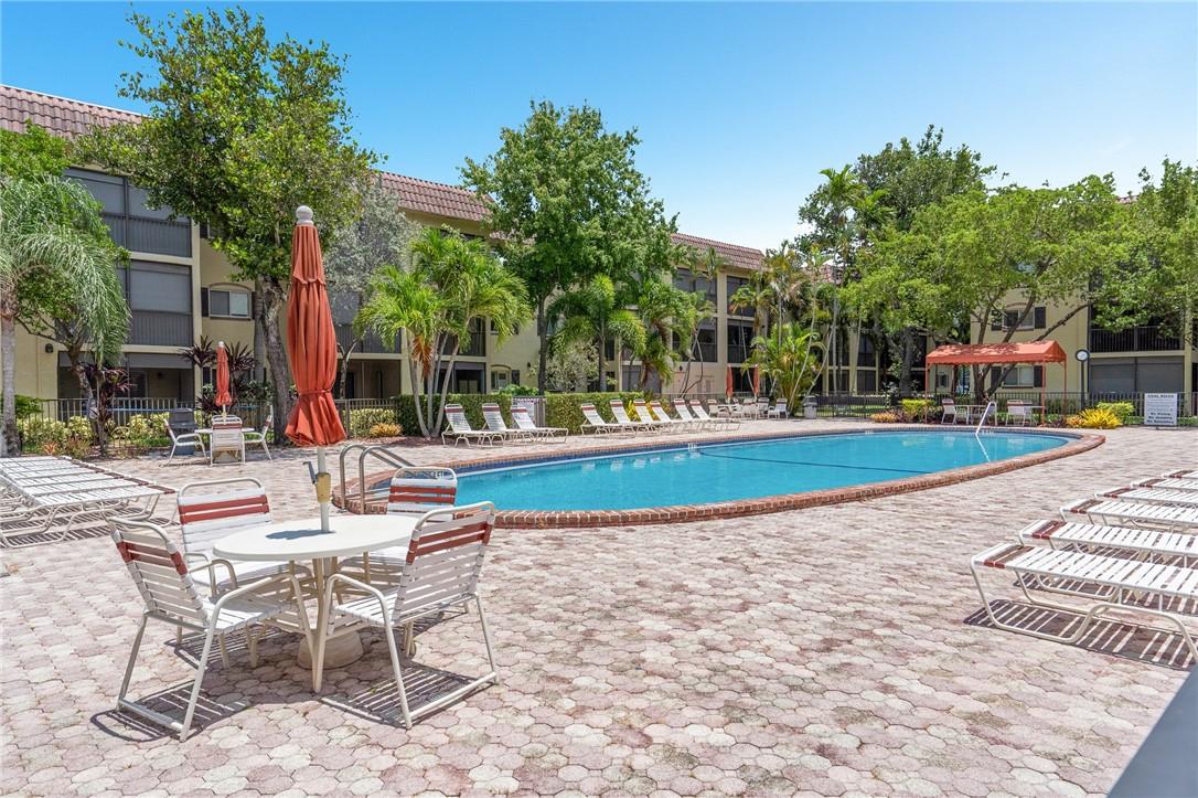 Great opportunity to live in a fantastic, fully furnished cozy ground floor unit in Barcelona North. Safe and very well maintained community in a great location - minutes to I-95, US-1, Pompano Beach Pier, The new Cultural Center, Starbucks - and an easy walk to Publix. Convenient Laundry on every floor, Pool and Tennis included as well as internet and wifi. Clubhouse, Kitchen, Billiards available and there is a security patrol for peace of mind. The home is clean and tastefully appointed with freshly refinished cabinets and counters, newer appliances and AC. Furnishings include dining for 6, accommodations for your friends and family, and a patio set for four. Everything is ready for move in including your pet up to 20 pounds.