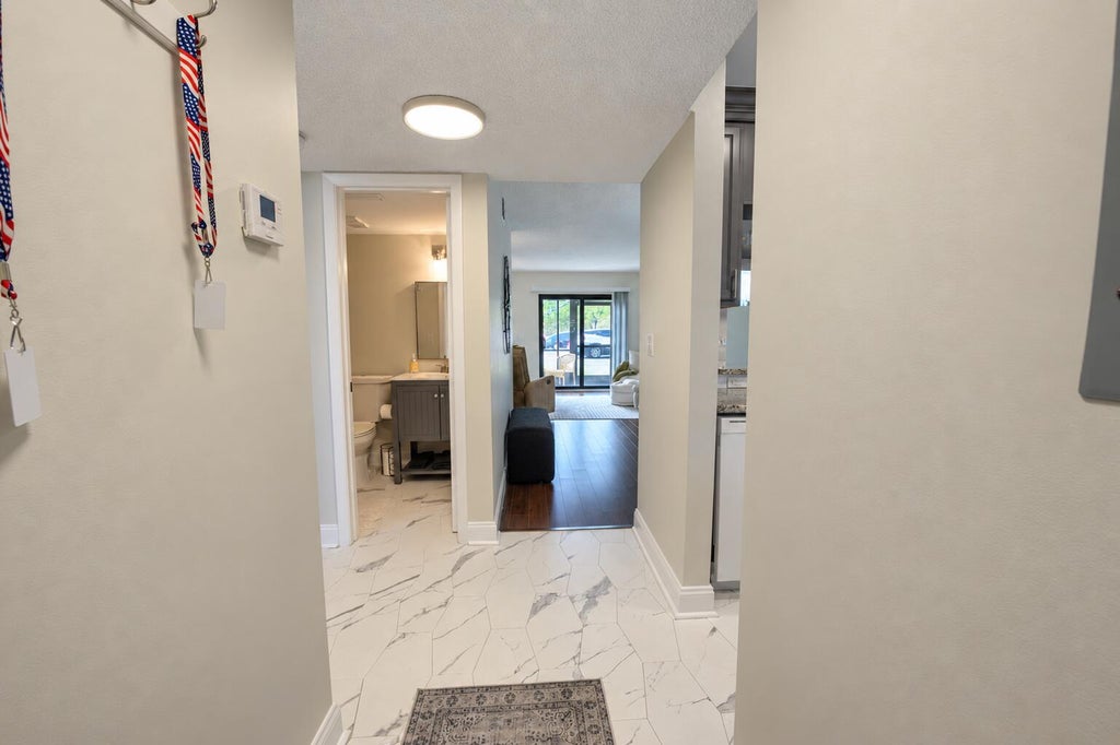 Photo of 7094 Golf Colony Court #103, Lake Worth, FL 33467 (MLS # B26083855)