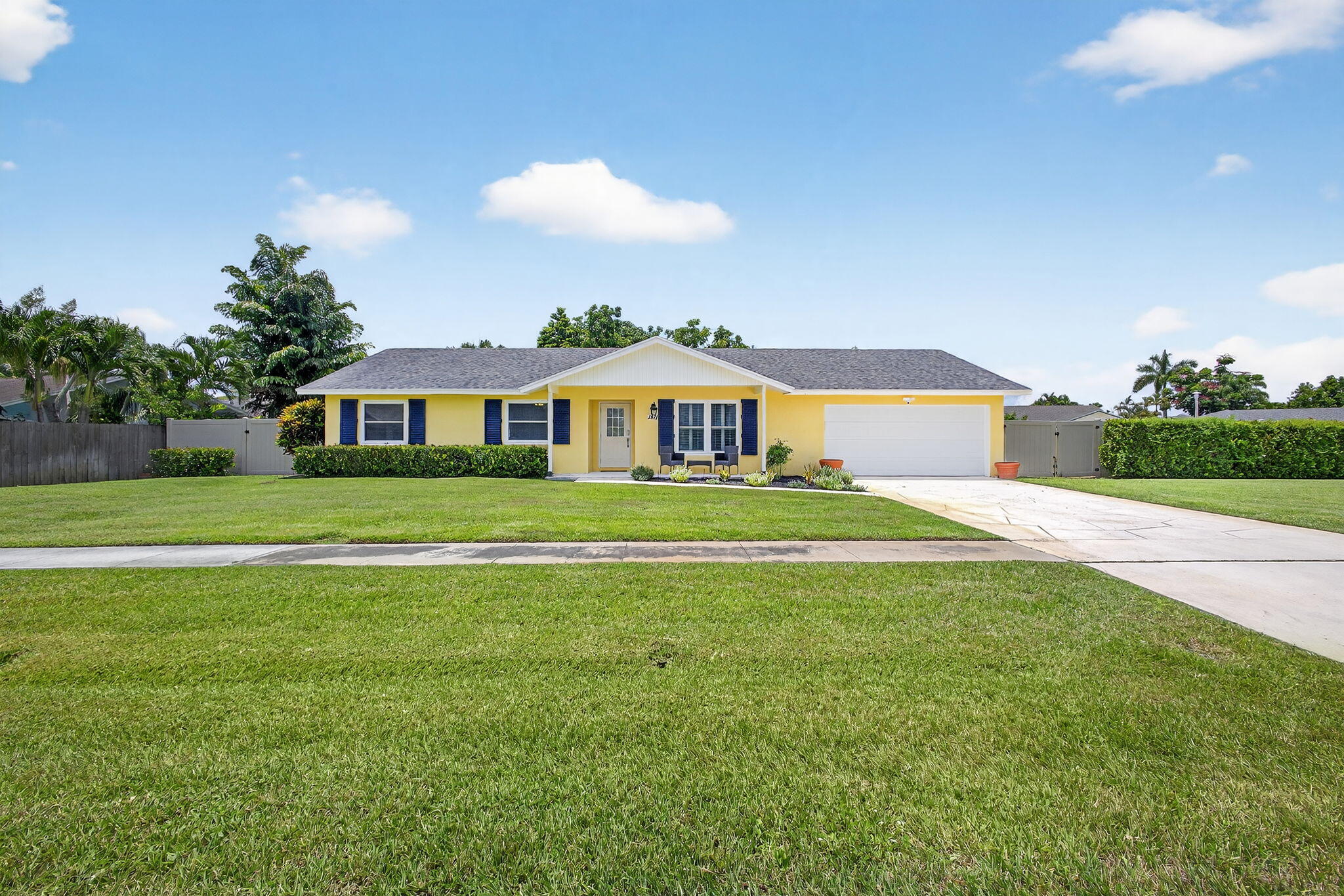Welcome to this beautifully updated 3 bedroom, 2 bathroom pool home in Wellington! This home sits on an oversized corner lot on a quiet cul-de-sac! Inside, enjoy an updated kitchen with modern finishes, updated bathrooms, new flooring throughout, brand new AC, new garage door, and roof only 6 years old! Impact windows provide peace of mind while the 2 car garage adds convenience! Step outside to your tropical oasis in your fully fenced backyard! The backyard features a sparkling saltwater pool, tiki hut, and plenty of space for a boat or swing set! This home is in a highly desirable neighborhood with NO HOA! Zoned for excellent A+ schools, less than 3 miles from the National Polo Center and the Wellington Green Mall. This is a must see! Schedule your showing on this gem today