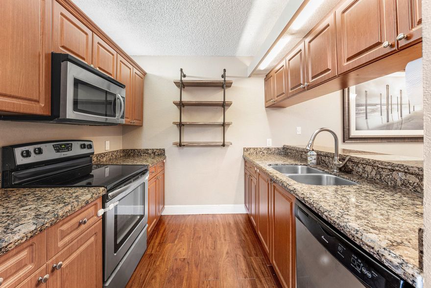 Two Bedroom, 2.5 bath Townhome in friendly community  Village of Sandalwood Lakes. Welcome home to traditional classic style!  Open family room and dining room setting. Kitchen has been upgraded with granite counters, stainless appliances and faux wood cabinetry. Raised Pass thru from kitchen to dining allows easy open views plus bonus cabinets in the kitchen for more storage!  Private Courtyard patios are perfect for pets, kids and entertaining! BBQ and relax in the outdoors! Both bedrooms have Juliet balconies and allow lots of natural light. All bathrooms have been updated with granite and new cabinetry! Master bath has standing glass door shower and a large countertop for getting ready. Guest room has wall to wall closet! This community HOA fee covers... Roof insurance, roof 2019, cable, internet, bldg insurance and common areas. Lots to do- with community pool, tennis, pickleball, picnic areas, playground, basketball, sports field and more. A/C 2016.