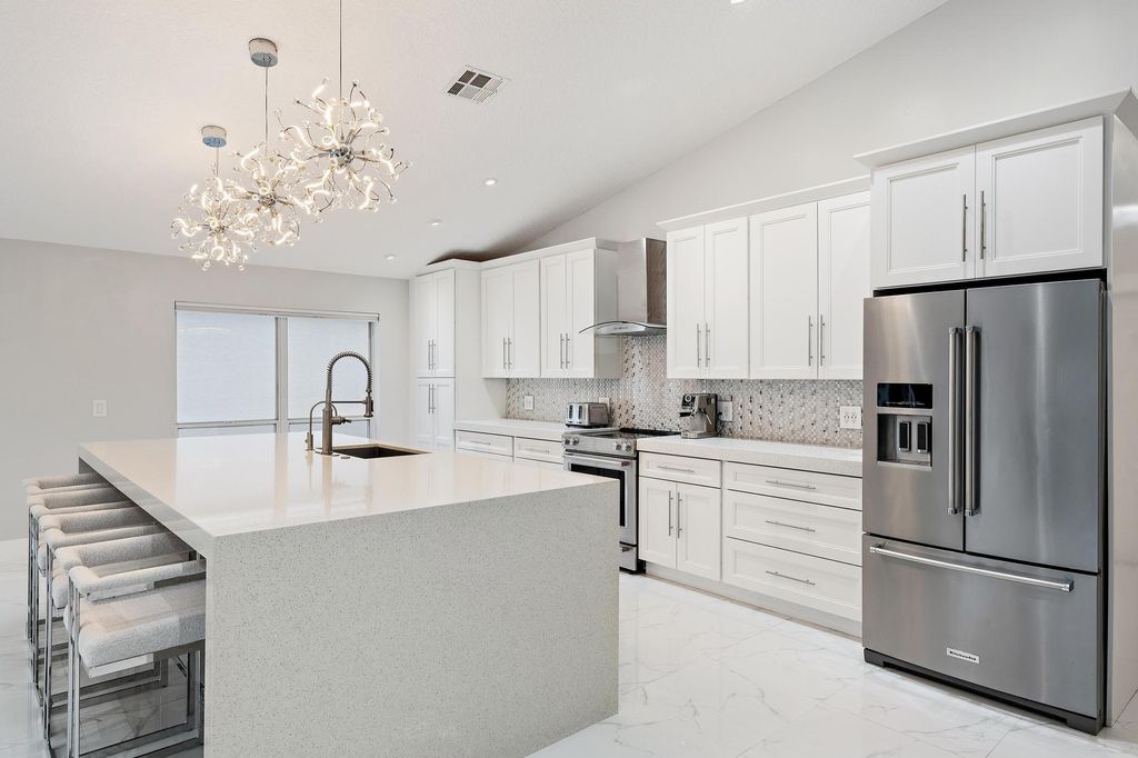 Photo of 1077 Siena Oaks Circle E, Palm Beach Gardens, FL 33410 (MLS # R11161348)