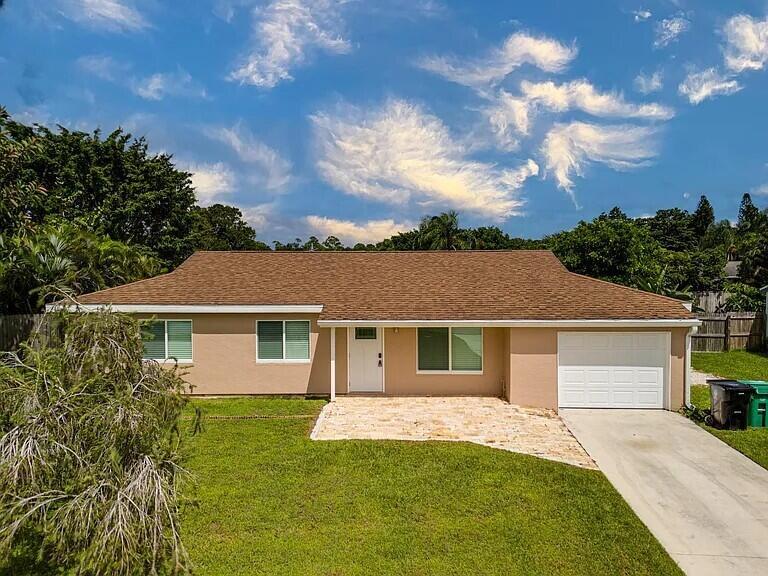Fully remodeled 3BR/2BA home in South Port St. Lucie with no HOA. Features new flooring, modern kitchen, updated bathrooms, impact windows/doors, and a 1-car garage with extra parking. Enjoy a large fenced backyard and screened-in covered patio--perfect for outdoor living and family entertainment. Prime location just minutes from Jensen Beach Mall, beaches, shopping and dining. Credit and background check required. Lease terms negotiable and owner is flexible. No pets.