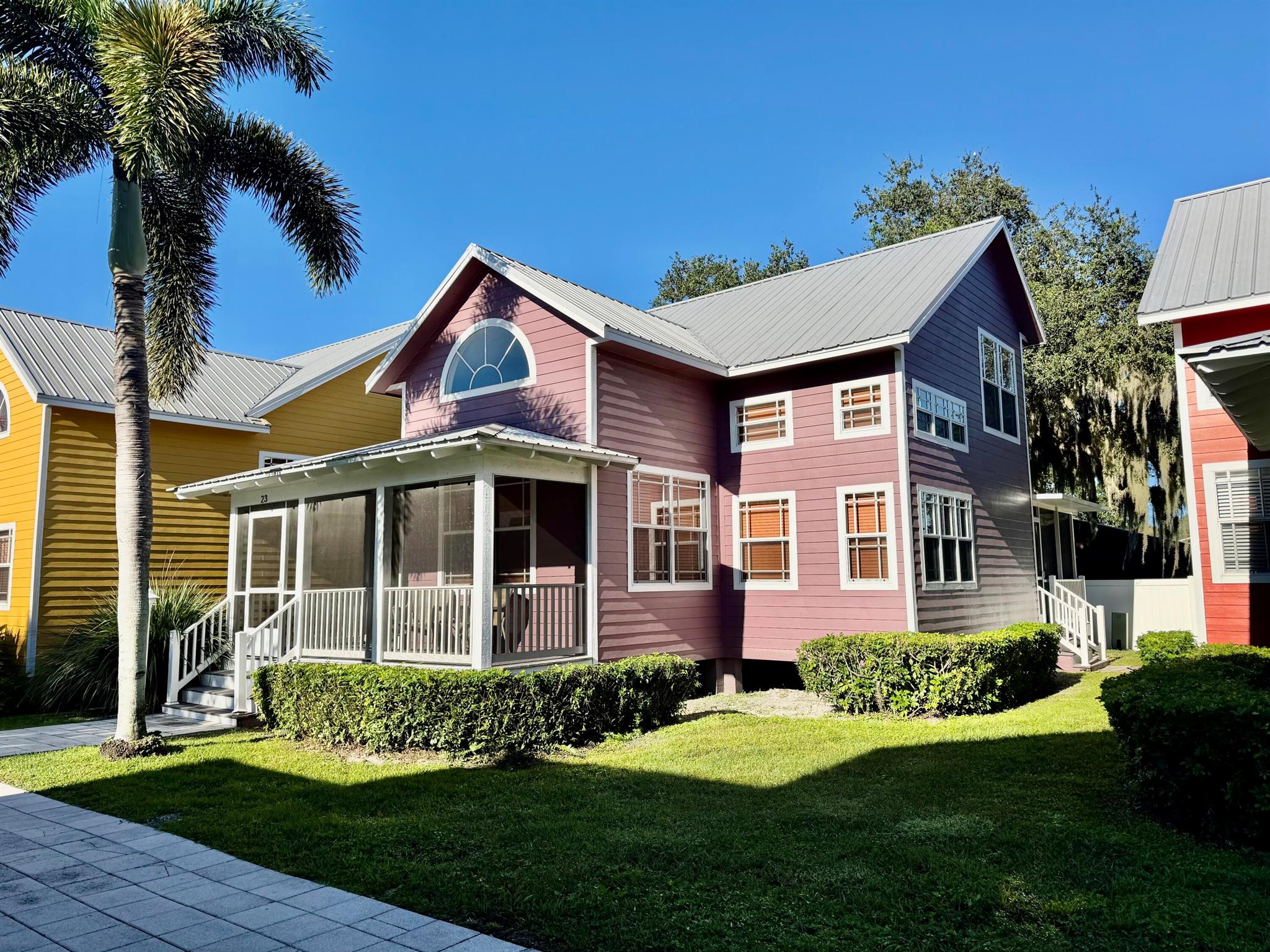 COTTAGES at the LAKE~ KEY WEST style bungalow with Lake ''O'' access from coast to coast. Beautifully remodeled, furnished and turnkey. Open concept, vaulted ceilings and fans. Staircase to upper Bd and Bath. Lower BR and Bath has stain glass doors, large closets, tiled showers and designer qualities! Kitchen is perfection~Knotty alderwood custom cabinets, soft close, pull outs shelves, SS appliances and two pantry's. Front and back screened porches. Covered parking, assigned dock, walking path and lovely neighbors! Your home away from home, no VRBO. See Condo docs, exterior insurance in Condo fee. Tankless HWH, Foam spray insulation under home. Superb!  LIVE the FLORIDA DREAM! Dimensions are approximate, must measure for exact