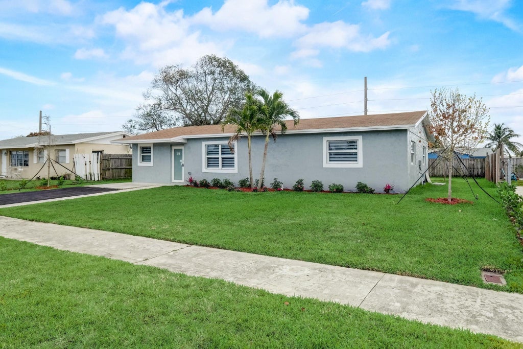 Photo of 520 SW 13th Place, Deerfield Beach, FL 33441 (MLS # F10442786)