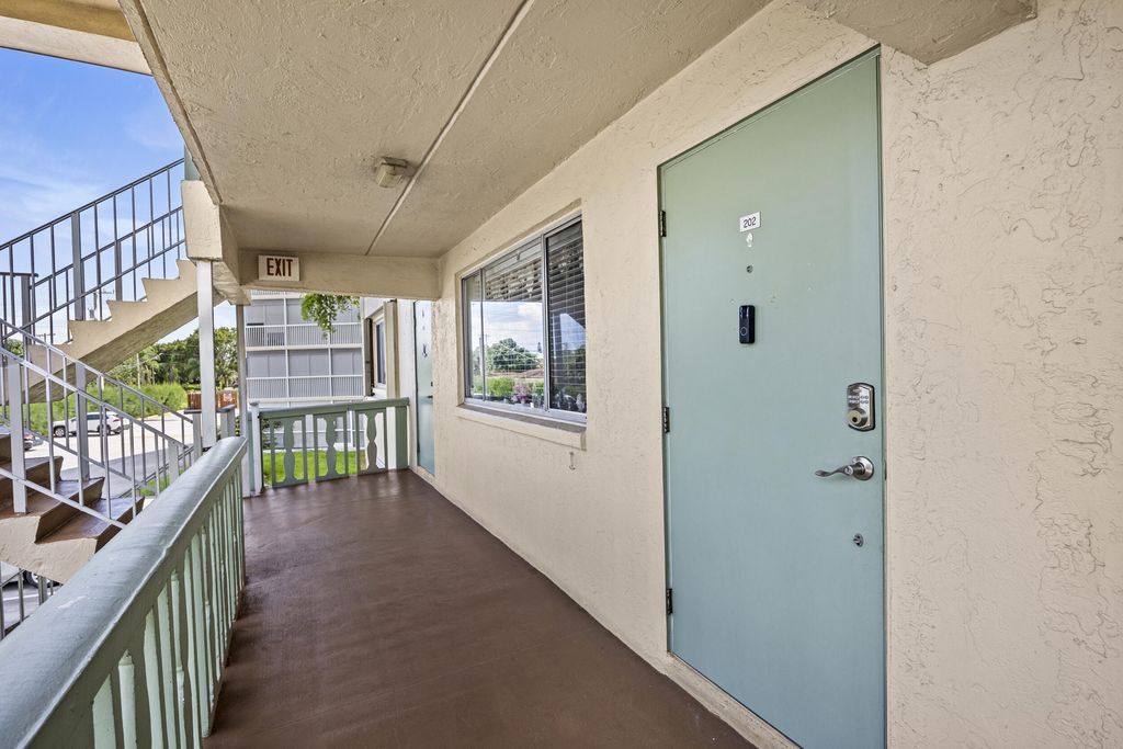 Photo of 200 Village Green Circle E #202, Palm Springs, FL 33461 (MLS # R11127870)