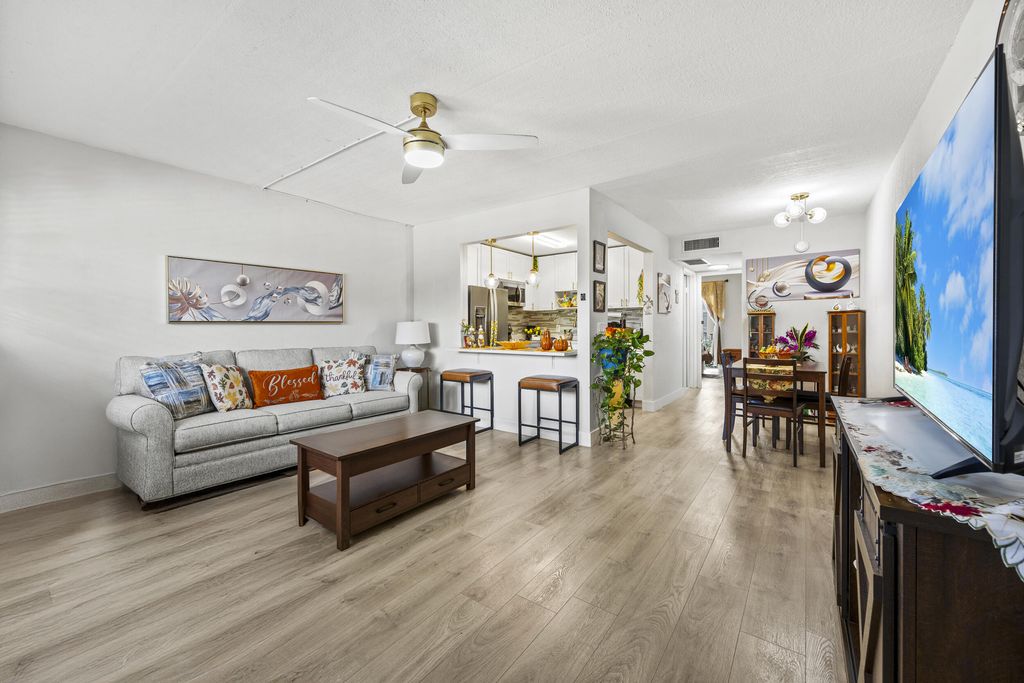 Photo of 200 Village Green Circle E #202, Palm Springs, FL 33461 (MLS # R11127870)