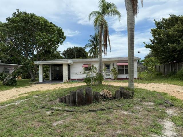 If you love the Rio area in Jensen Beach, you will love this adorable old florida style home! 2 Bedrooms and 1 full bath with a nice size kitchen area. Separate laundry room across the carport. Has a full house AC and a circular driveway. Large fenced back yard with visits from the Rio peacocks. Quiet neighborhood.