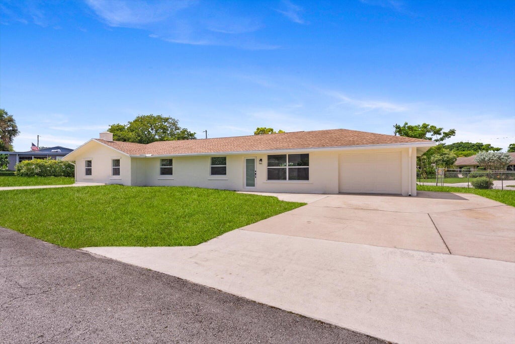 Photo of 6873 S PLYMOUTH Drive S, Lake Worth, FL 33462 (MLS # B26078740)