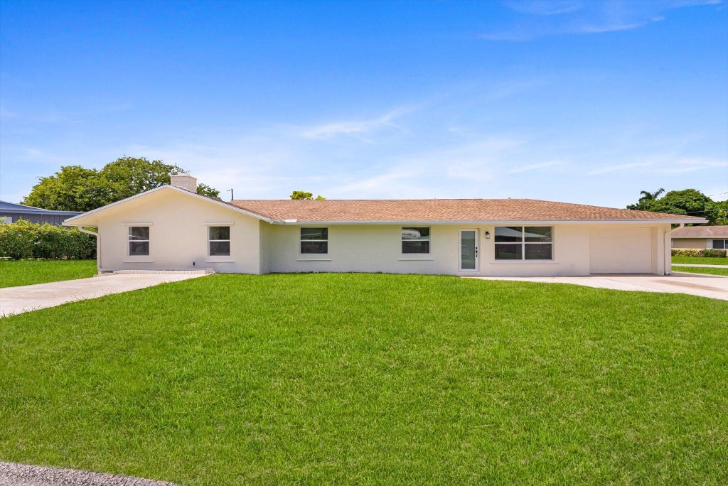 Photo of 6873 S PLYMOUTH Drive S, Lake Worth, FL 33462 (MLS # B26078740)