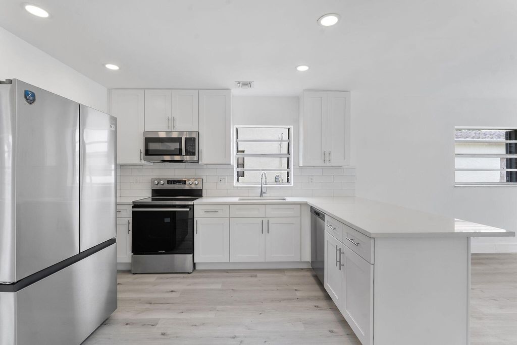 Photo of 488 NW 2nd Terrace, Deerfield Beach, FL 33441 (MLS # B26046817)