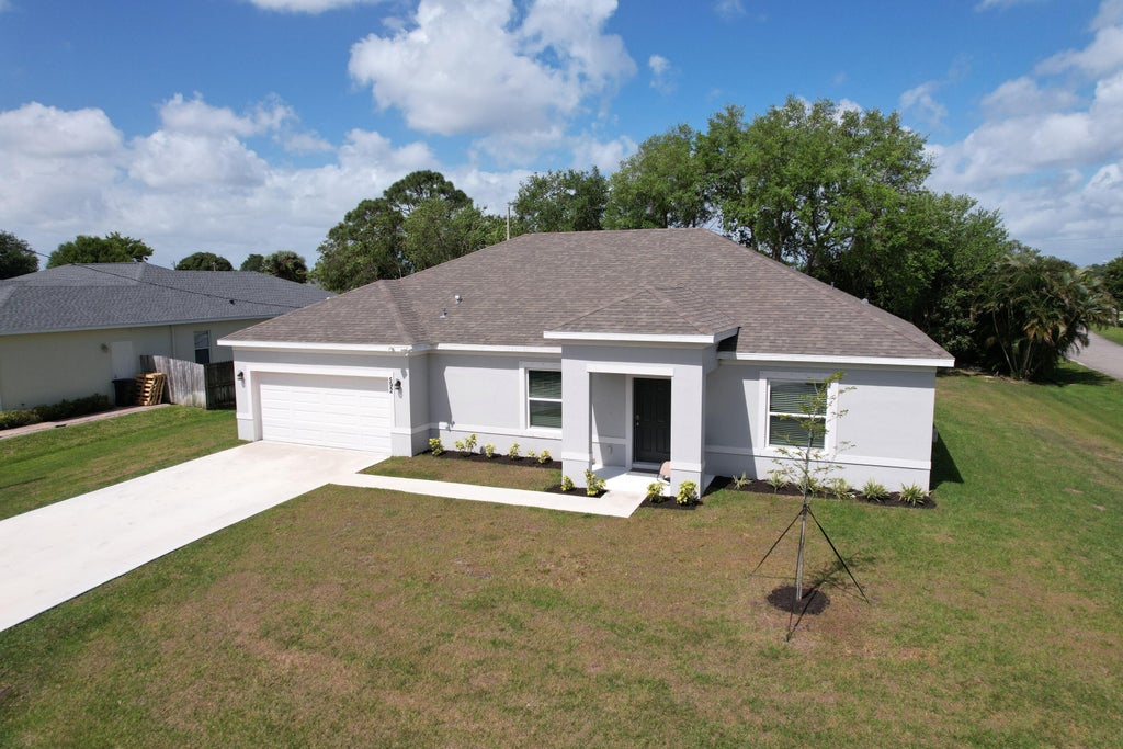 Photo of 592 SW Dauphin Avenue, Port Saint Lucie, FL 34953 (MLS # R10970569)