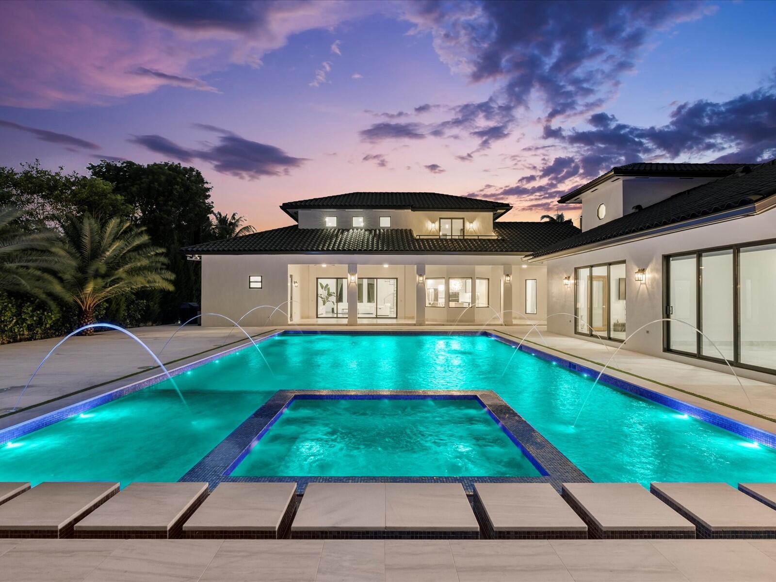 This beautifully renovated 5-bedroom, 4-bathroom home is situated on just over an acre lot in the heart of Sunset. This exceptional property offers both luxury and potential, with half of the expansive lot awaiting your vision.Step inside through a gated entrance, past the protective embrace of a concrete wall, and into a sanctuary of privacy and security. Revel in the beauty of new flooring, a completely renovated kitchen and new bathrooms completing the modern transformation.The family room, with its soaring 20-foot ceilings and abundant natural light, is a testament to spacious, bright living. A loft, currently an entertainment haven with a pool table & bar, features a balcony with a breathtaking view of the backyard