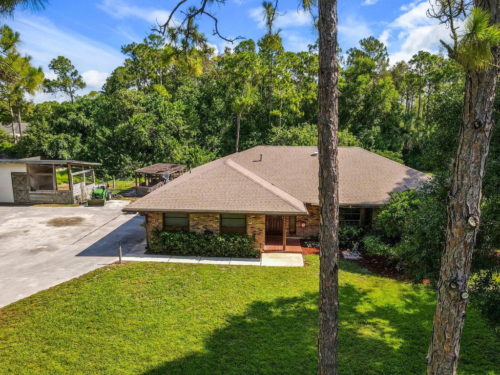 Photo of 16033 E Cheltenham Drive, The Acreage, FL 33470 (MLS # R10897558)