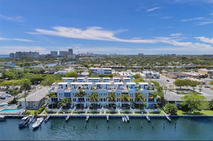 Boaters, boaters, boaters, a boater's dream! Experience waterfront living in this modern Intracoastal townhome with a private 30+ ft boat slip, offered fully furnished for easy move-in. Featuring 3 bedrooms and 3.5 baths across four levels, the home boasts soaring ceilings and floor-to-ceiling windows that flood the space with natural light. The chef's kitchen offers Italian cabinetry, marble finishes, smart home technology, and a private elevator. Enjoy marina views from the rooftop terrace and multiple balconies. Minutes from the best beaches, dining, and shopping, this home delivers luxury and the ultimate boating lifestyle.