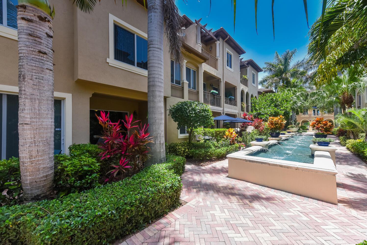 Enjoy coastal living in this beautifully upgraded 2BR + Den/3BA townhome located just steps from the Intracoastal in the gated community of Waterside Village in Boynton Beach. This spacious two-story home features a 2-car garage, a large primary suite with sitting area, dual walk-in closets, and a private balcony with peaceful fountain views. The kitchen offers granite countertops, stainless appliances, and wood cabinetry. Relax or entertain on the covered patio. Waterside includes access to resort-style amenities: pool, fitness center, and clubhouse. Ideally located near beaches, shopping, dining, and I-95.