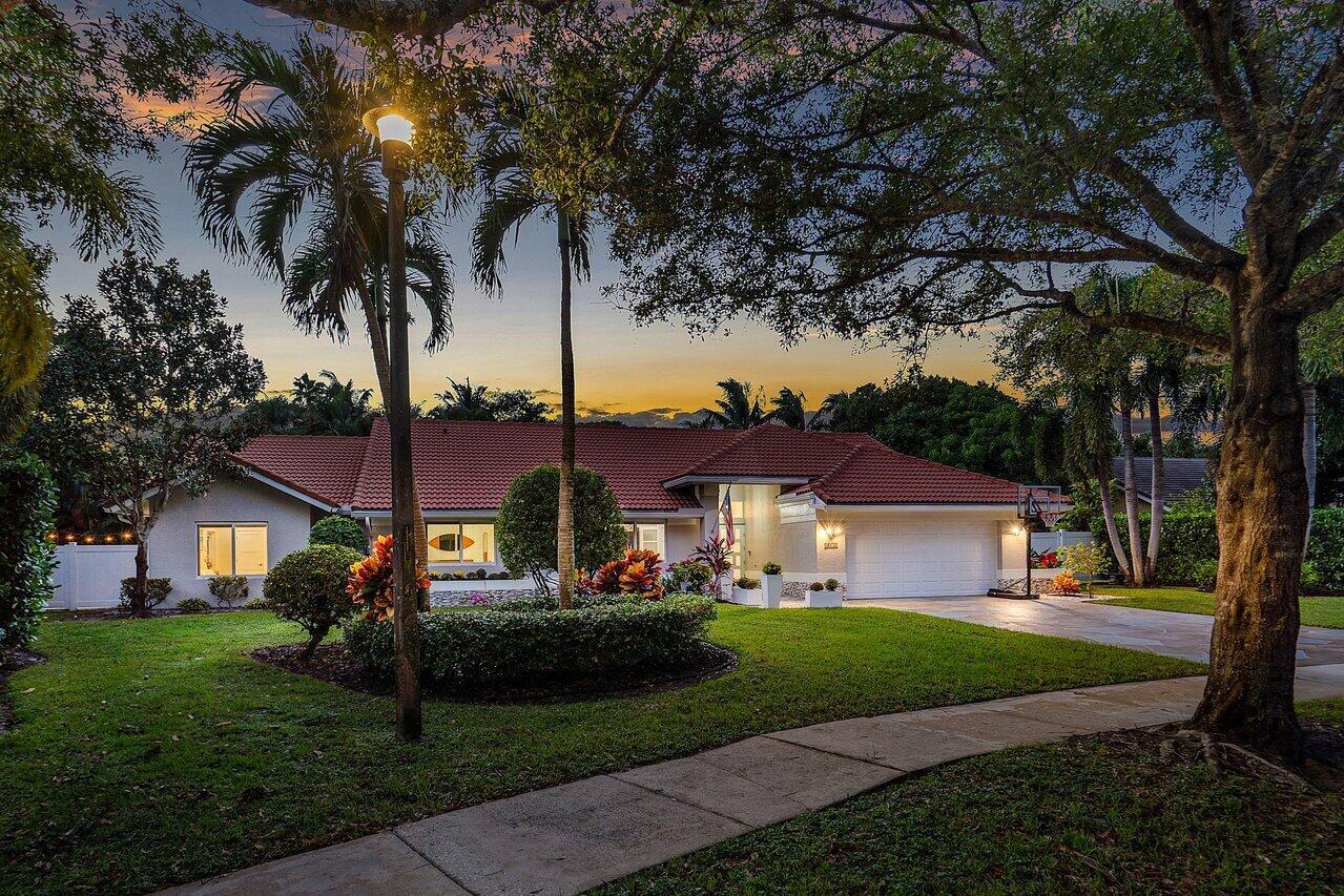 Absolute perfection! Stunning completely renovated, like new home with a pool on over 1/3 acre in Delray Beach. Prime location in Verona Woods off Germantown Road just minutes from the beach and Delray's many area attractions, shopping and restaurants. Quick access to I-95. Single story, high ceilings, sprawling, open floor plan drenched with natural light. Extensive custom upgrades with tile floors throughout. Chef's kitchen with a marble island and JennAir appliances. 4 bedrooms and 4 bathrooms includes a in-law suite with its own entry, refrigerator and sink. Screened in back patio with pool and stand-alone spa. Spacious, lushly landscaped backyard with a lounging area. This house is turnkey. Step into a this stunner and live a Floridian dream lifestyle!