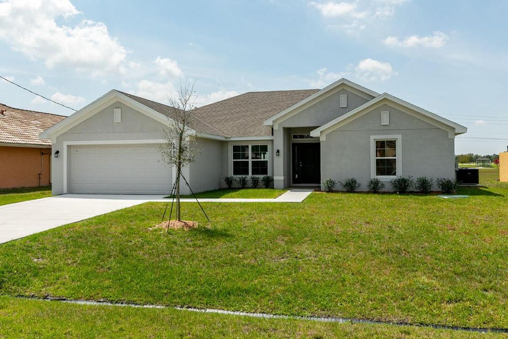 Photo of 6519 NW Omega Road, Port Saint Lucie, FL 34983 (MLS # R10918034)