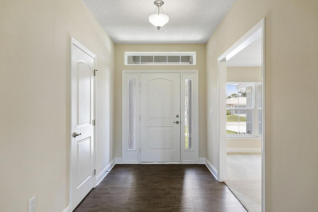 Photo of 6519 NW Omega Road, Port Saint Lucie, FL 34983 (MLS # R10918034)