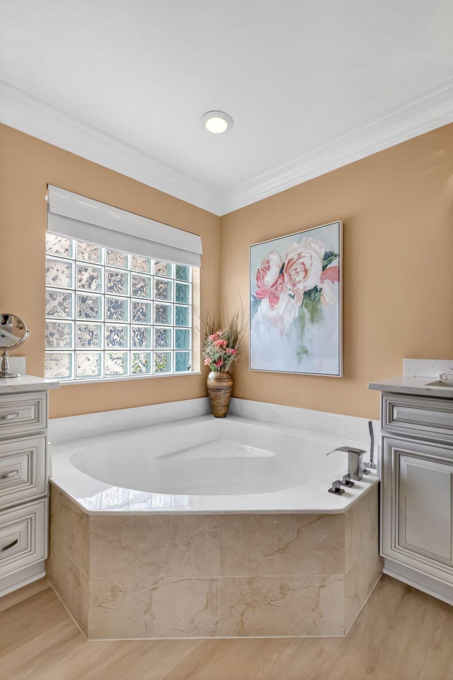 BRING YOUR SUITCASE & TOOTHBRUSH SO YOU CAN MOVE RIGHT IN TO THIS ELEGANT, SOPHISTICATED, IMPECCABLY UPDATED & MAINTAINED SOUTH PACIFIC MODEL ON THE WATER!  LUXURY VINYL FLOORS INSTALLED 2025, ROOF REPLACED 2024, A/C REPLACED 2023, PRIMARY BATHROOM UPDATED 2023 WITH NEWER CABINETS, QUARTZ COUNTERTOPS, UPDATED FIXTURES & FAUCETS, FRAMELESS GLASS SHOWER DOOR.  THE KITCHEN HAS ALSO BEEN UPDATED WITH WOOD CABINETS, QUARTZ COUNTERTOPS WITH TILE BACKSPLASH, LOTS OF POT DRAWERS, CONTEMPORARY PENDANT LIGHTS, GORGEOUS SAMSUNG FINGER PRINT RESISTANT APPLIANCES TOPPED OFF WITH A COZY BREAKFAST NOOK.  CROWN MOLDING EVERYWHERE FOR A TOUCH OF ELEGANCE.  THE FAMILY ROOM, DINING ROOM, PRIMARY BEDROOM & GUEST BEDROOM ALSO HAVE PLANTATION SHUTTERS.  THE DINING ROOM & FAMILY ROOM HAVE A CATHEDRAL      CEILING WHICH CREATES A LARGE OPEN FEELING.  THE LANAI IS COVERED, EXTENDED AND SCREENED-IN WITH A TILE FLOOR WHICH IS PERFECT FOR ENJOYING THE FLORIDA OUTDOORS.  ACCORDION SHUTTERS TO KEEP YOU SAFE FOR HURRICANE PROTECTION.  YOU HAVE TO SEE THIS HOME TO TRULY APPRECIATE THE CARE AND PRIDE OF OWNERSHIP FOR THIS HOME.  VALENCIA FALLS IS A 55+ COMMUNITY.  THE CLUBHOUSE HAS BEEN RECENTLY RENOVATED & IT IS SPECTACULAR!  THIS HOME AND THE CLUBHOUSE ARE A MUST SEE!  ALL MEASUREMENTS & INFORMATION ARE DEEMED ACCURATE & SHOULD BE INDEPENDENTLY VERIFIED.