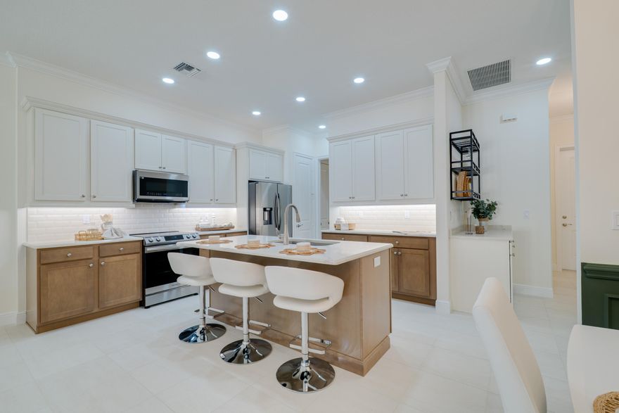 ASK ABOUT LENDER INCENTIVES - BUILT 2024+ builder warranty in a gated Vero Beach community! This 3BR/2.5BA, 2-car garage townhome offers quartz countertops, stainless steel appliances + washer/dryer, solid wood doors, soft-close cabinets, coffered ceilings, and French doors to a covered lanai. Built with a metal roof and impact windows for peace of mind. Enjoy a remodeled clubhouse, heated pool & gym and all minutes from Miracle Mile shopping, downtown dining, McKee Botanical Garden, and the beloved Farmers Market. Beaches and the regional airport with direct flights are just a quick drive away!