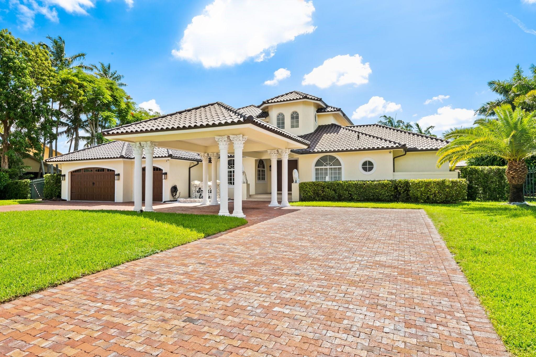 Fully renovated in 2022, this custom luxury residence blends timeless elegance with modern comfort. Set on a serene lake, it features a newly redone pool and a lush backyard with a covered patio—ideal for relaxing or entertaining. Inside, the designer-decorated interior includes impact windows, a gourmet kitchen with new high-end appliances, and marble floors throughout. Custom built-ins and French doors offer seamless indoor-outdoor living. The layout features 5 bedrooms on the main floor, while the expansive upstairs primary suite offers a private balcony and attached den. A crystal chandelier highlights the grand foyer with refined style. Additional features include an automatic generator, new roof, and upscale finishes throughout—crafted for the most discerning buyer.