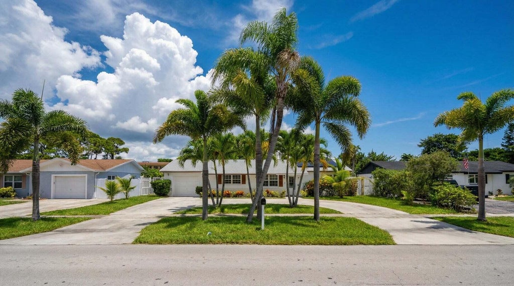 Photo of 428 ALEMEDA Drive, Palm Springs, FL 33461 (MLS # B26071881)