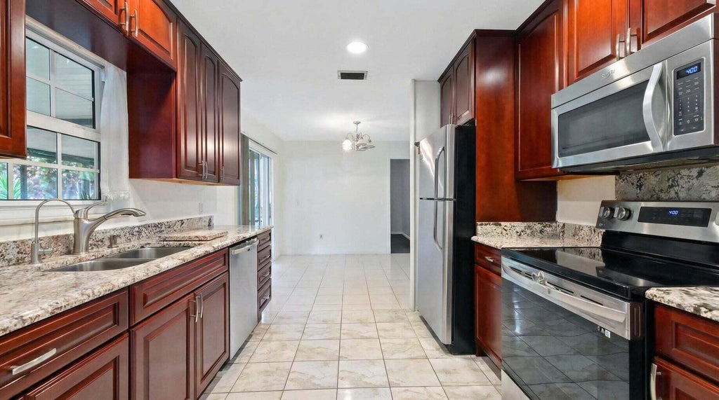 Photo of 428 ALEMEDA Drive, Palm Springs, FL 33461 (MLS # B26071881)