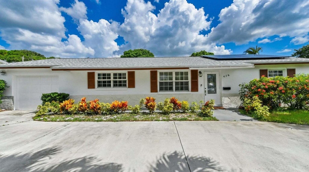Photo of 428 ALEMEDA Drive, Palm Springs, FL 33461 (MLS # B26071881)