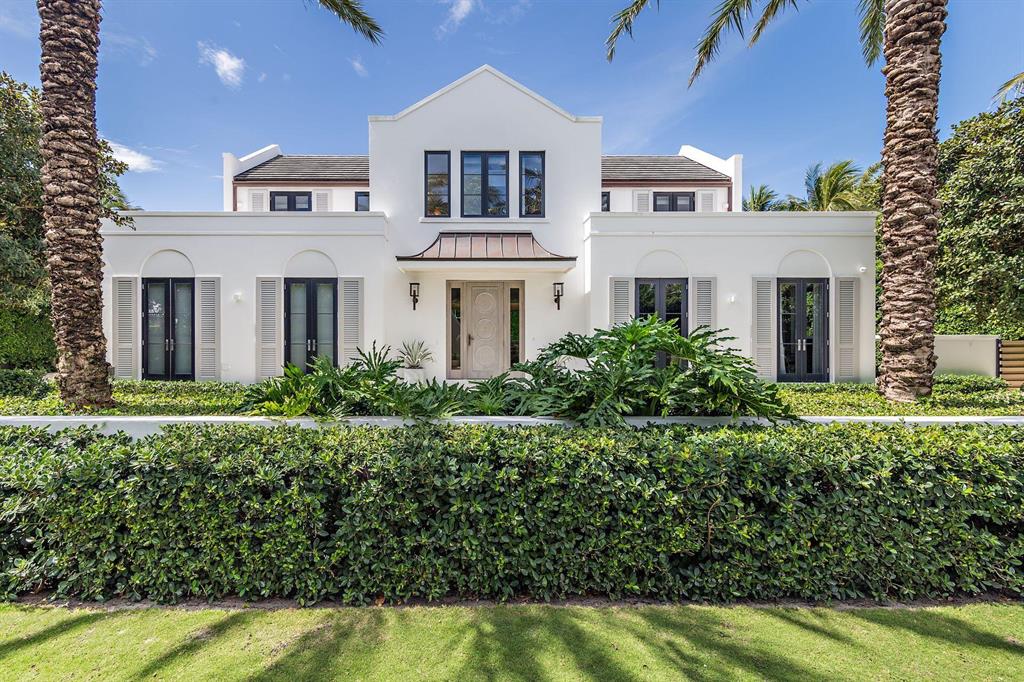 This Contemporary Beach house is located in the very desirable northend. The vaulted ceilings throughout give volume to the entire home. The spacious living room opens to a covered outdoor living area overlooking the pool and manicured backyard. The 1st floor primary bedroom has been redesigned and expanded to accommodate his and her separate closets, vanities and toilets. The second floor contains an informal living room and three guest bedrooms, each with on-suite bathrooms and their own terrace. With deeded beach cabana access, infinity-edge south facing 50' lap pool, outdoor shower, full house generator, air conditioned two-car garage and a 1st and 2nd floor laundry, this move-in ready home has it all.