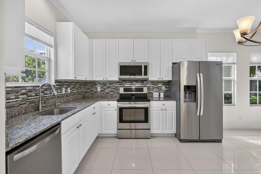 Photo of 4216 Leo Lane #4F, Riviera Beach, FL 33410 (MLS # B26092378)