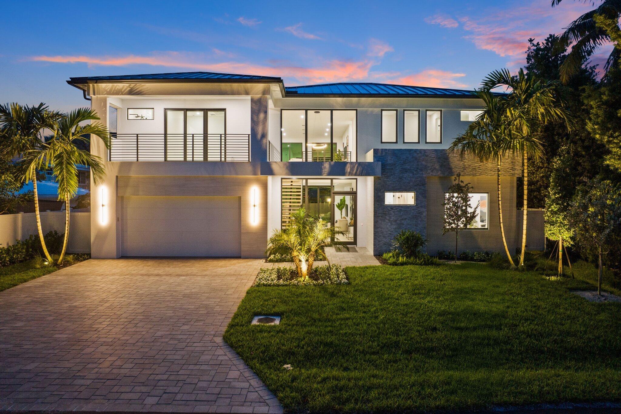 Welcome to your dream home, located in the highly sought after Lake Ida neighborhood. Exquisitely designed, this 5 bedroom, 5 full bathroom brand new residence offers exceptional living with thoughtful features and high-end finishes throughout. The moment you enter the grand 21' high foyer, accented by a stunning floating staircase, the tone is set for the home's sophisticated design. The heart of the home is the spacious family room with floor to ceiling, 10' high pocket sliders that disappear behind the wall and open to the huge, covered lanai overlooking the sparkling saltwater pool, creating a resort style atmosphere. The lanai features a full outdoor summer kitchen, ideal for gatherings and relaxing evenings in our wonderful South Florida climate. Primary suite is a lavish