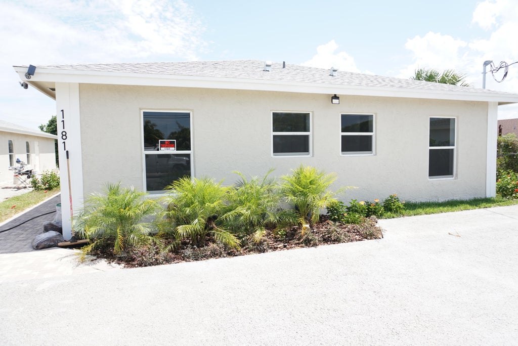 Photo of 1181 W 28th Street, Riviera Beach, FL 33404 (MLS # B26082187)