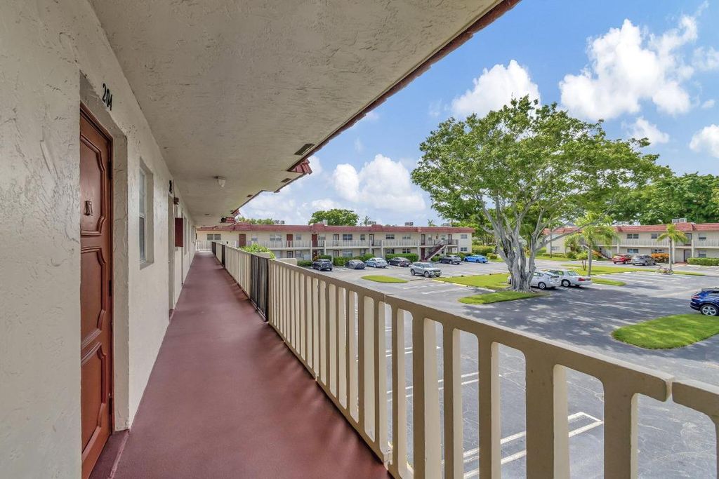 Photo of 21 Abbey Lane #204, Delray Beach, FL 33446 (MLS # R11012900)