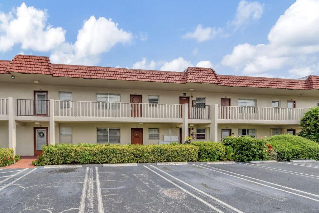 Photo of 21 Abbey Lane #204, Delray Beach, FL 33446 (MLS # R11012900)