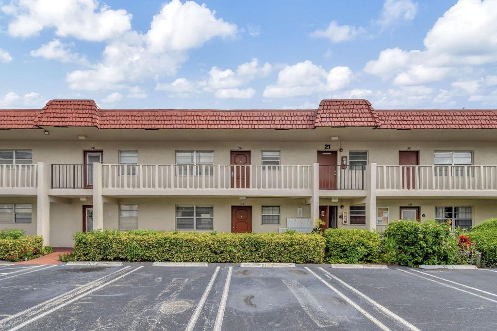 Photo of 21 Abbey Lane #204, Delray Beach, FL 33446 (MLS # R11012900)