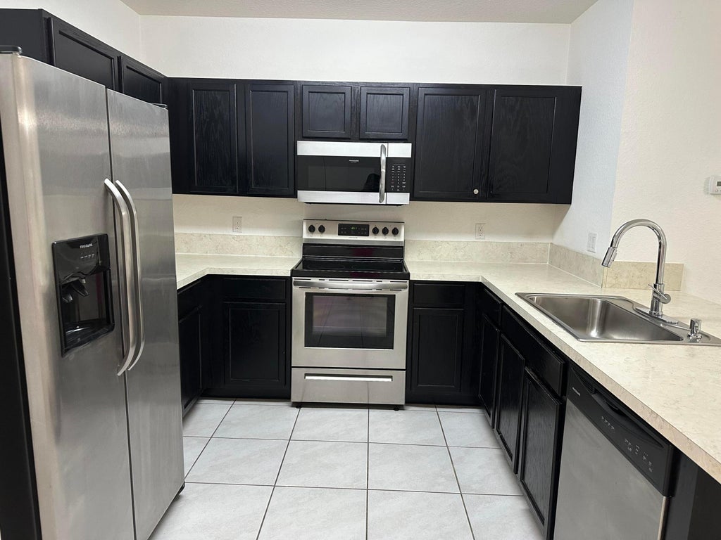 Photo of 3779 WHITNEY PARK Lane, Greenacres, FL 33463 (MLS # B26075566)
