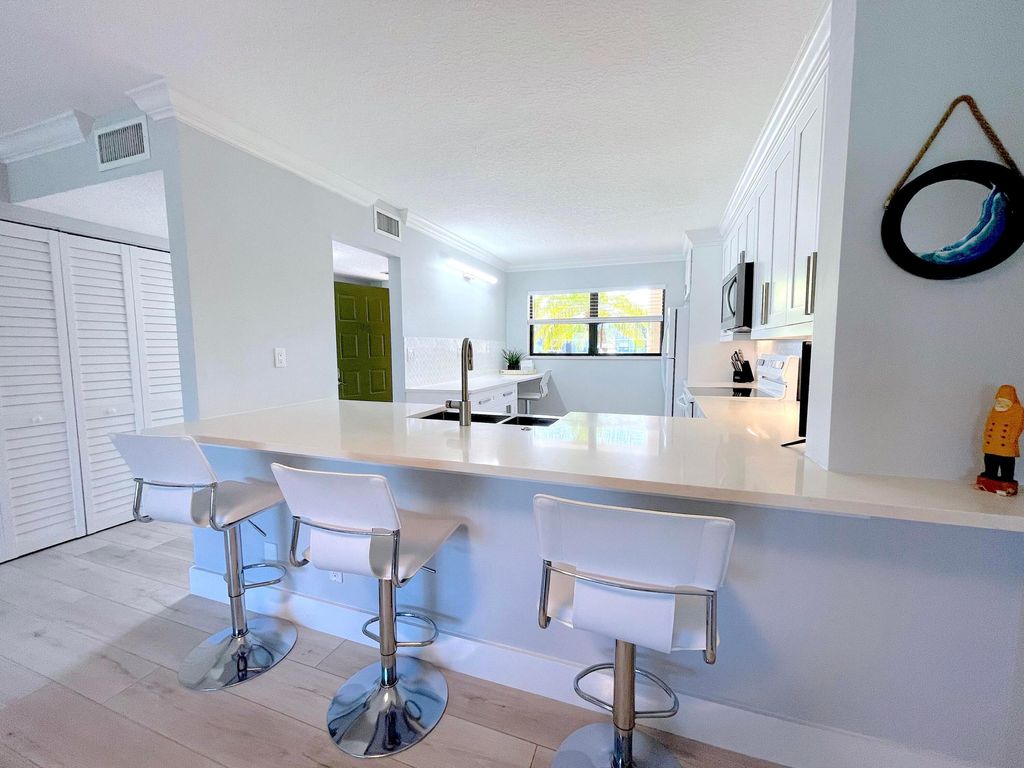 Photo of 13403 Touchstone Place #A-102, Palm Beach Gardens, FL 33418 (MLS # R11125013)