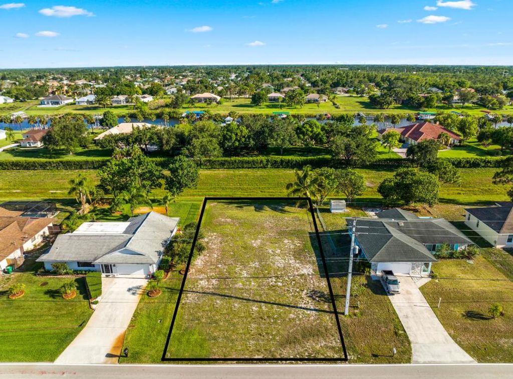 Photo of 150 SW Oakridge Drive, Port Saint Lucie, FL 34984 (MLS # R10803806)