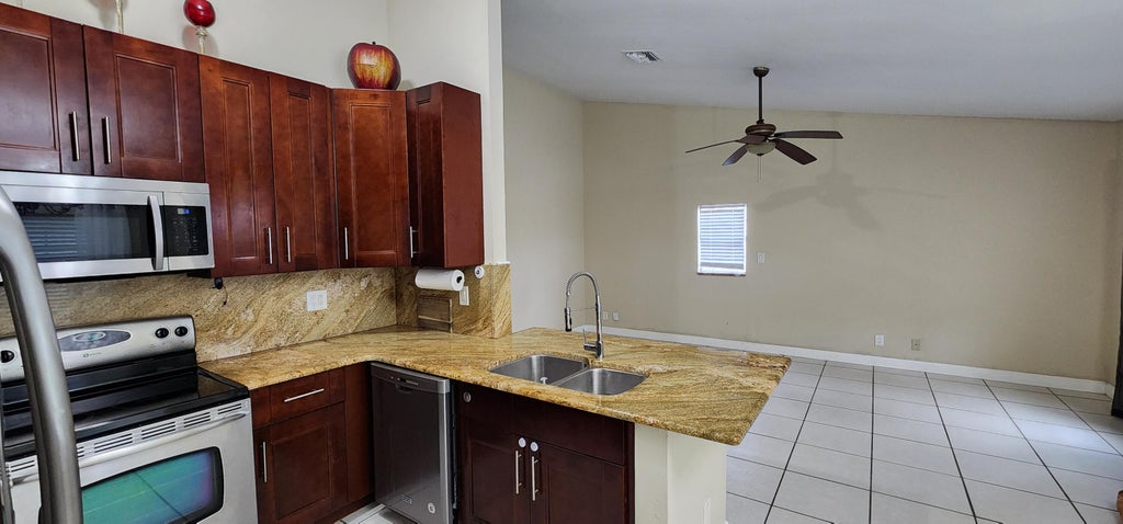 Photo of 22943 Sandalfoot Boulevard, Boca Raton, FL 33428 (MLS # R11026058)